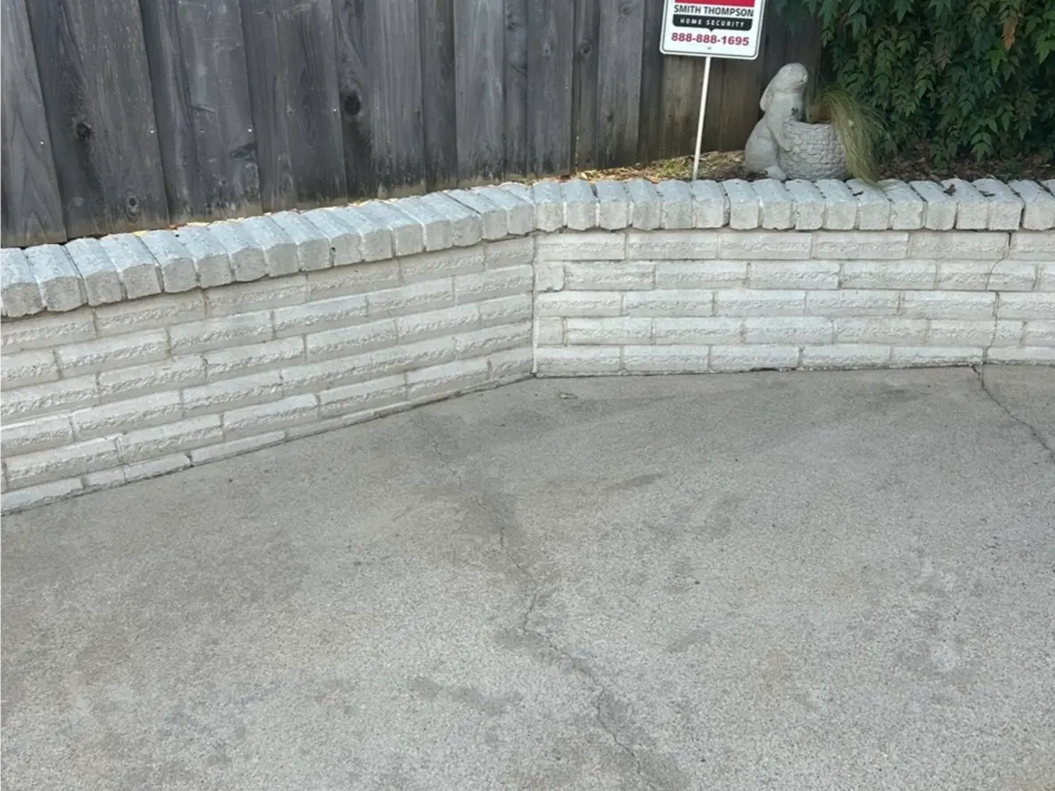 Brick wall and patio after pressure washing
