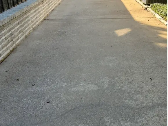 Side driveway after pressure washing by Stegmeier in the DFW area
